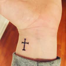 If you want something that's not only dynamic going by the looks but also simple, the consider going for such a design. 32 Cross Tattoos On Wrist For Men