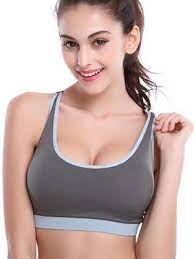 一隻手址住個sports bra,另一住手就sip穿入去件sports bra 入面，step 2. How To Take Off A Sports Bra Sports Bra Sport Suit Women Bra Clothes