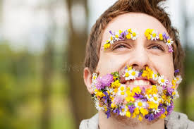 Portrait of a Guy with Flowers instead of His Beard Stock Photo
