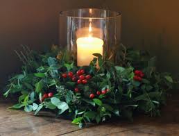 Holly Berries And Candles Christmas Table Centerpieces Christmas Table Decorations Christmas Flowers