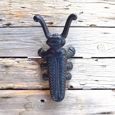 5 out of 5 stars. Cast Iron Scarab Door Stop Vintage Antique Figurine Beetle Bug Insect Door Stopper Boot Jack Housewarming Gift Shoe Remover Collectible Door Stopper House Warming Gifts Antique Cast Iron