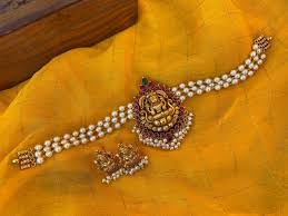 Simple yet so ethereal, pearls are always in fashion and transition easily from day to evening wear. Latest Antique Pearl Lakshmi Choker South India Jewels Gold Fashion Necklace Pearl Necklace Designs Black Beaded Jewelry