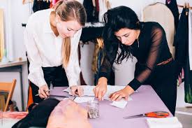 Two Fashion Designers Working On A Paper Pattern By Michela Ravasio Stocksy United They must be flexible in scheduling meetings with clients.