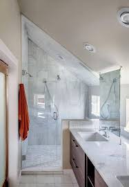 Love the marble floor to ceiling backsplash and hexagon floor tile from @flooranddecor , mirror and light fixture by @rejuvenationinc and faucet/fixtures by @deltafaucet. Working With Sloped Ceilings In The Bathroom Mecc