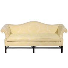 This classic and refined sofa, named for its graceful arched back, was a thomas chippendale original and was fashionable from the 18th century to the mid 19th century. Chippendale Style And Upholstered Camelback Sofa And Down Seat 20th Century At 1stdibs