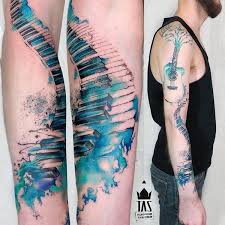 Simple and beautiful, a stylized f clef for sheet music, but the music notes are splashes of watercolor. 35 Awesome Music Tattoos For Creative Juice