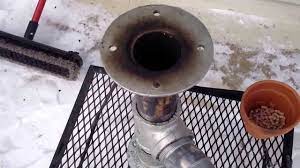 Cut open the burning chamber. Video 3 Diy Rocket Stove Updated Easy No Tools In Action Testing And Boiling Snow Youtube