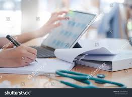 Closeup Female Doctor Hand Writing On Paperwork With Pen While Working With Tablet At Table In Hospital Ad Ad H In 2020 Female Doctor Photo Editing Stock Photos