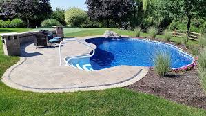 Then, the gravel, grass, and rocky steps are enough to create a cozy atmosphere for the. Radiant Semi Inground Freeform With Walk In Steps And Water Feature Backyard Pool Landscaping Pool Landscaping Radiant Pools