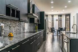 In a modern kitchen, white kitchen cabinets with black countertops are often found. Kitchen Cabinets Image Galleries For Inspiration