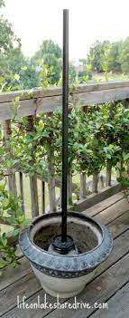 Made of plastic that has the look of metal, it is lightweight, yet it's sturdy and will hold up in all types of weather. Diy Solar Lights Lamp Post Solar Lights Diy Diy Planters Outdoor Garden Planters Diy