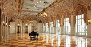 The east wall, made almost entirely of glass allows for a view to the lawn, ocean and the reef that gave the breakers its name. The Breakers Luxury Palm Beach Resort