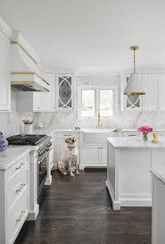 We built some mdf cabinets and instead. White And Gold Kitchen With White Powder Coated Range Hood Transitional Kitchen