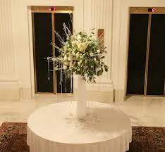 White bridal bouquet of roses and baby's breath. Wedding Flowers Weddings By Bakanas