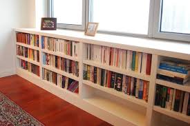 Bookshelves pull double duty as storage for novels and display space for accessories. How Much For Those Gorgeous Built In Bookshelves
