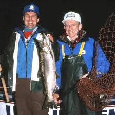 Here friend and now retired fishing tackle salesman Ron Hiller shows off a  fall chinook he caught from Oregon's Wilson River in December of 1993. Tom  Posey netted the bright fish for