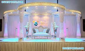 Chair covers and bows are an essential addition to ensure that your venue is neatly and smartly dressed, our centrepieces add a touch of elegance to your wedding and the head tables are an important focal point for the guests as it will normally accommodate the marriage couple. Indian Asian Wedding Decor Crystal Mandap Dst International