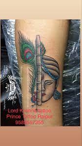 Lord Krishna Tattoos With Flutes In 2021 Krishna Tattoo Feather Tattoo Design Hand Tattoos For Girls