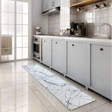 A rug with runner dimensions can fit the length of a galley kitchen, or a traditional, more rectangular piece can slot underneath a kitchen dining nook or informal dining table. Stylish Kitchen Rugs That Will Liven Up Your Kitchen Rugs You Ll Love Lonny