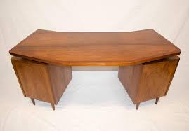 A trunk or bench can work beautifully as a coffee table with added storage as a bonus. Midcentury Walnut Curved Desk Floating Top At 1stdibs