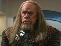 I have a weird question to ask. The disease that phlox is kidnapped and  forced to heal. Is that what they were using to explain why klingons look  so different in TOS? |