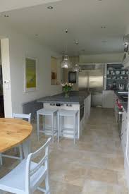 Cabinetry extends to the ceiling in this sleek, modern kitchen design. Help With Layout Of Long Narrow Kitchen Diner Houzz Uk