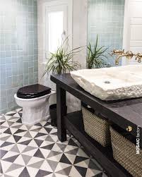 Black And White Geometric Bathroom Tiles Light Blue Bathroom Wall Tiles And Grey And White Cement Tiles With Geometric Tile Pattern Geometric Tiles Bathroom Bathroom Wall Decor Diy Grey Bathroom Floor