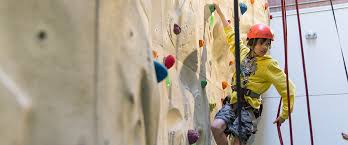 A climbing wall is an artificially constructed wall with grips for hands and feet, usually used for indoor climbing, but sometimes located outdoors. Climbing Walls