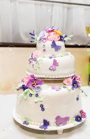 Your wedding cake butterflies stock images are ready. White Wedding Cake With Sugar Butterflies And Flowers Stock Photo Picture And Royalty Free Image Image 43183424