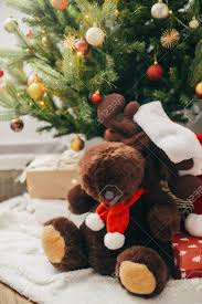 Check spelling or type a new query. Cute Reindeer Toy In Santa Hat Under Modern Decorated Christmas Stock Photo Picture And Royalty Free Image Image 154062633