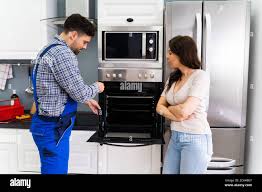 Oven Appliance Repair And Maintenance By Technician Stock Photo - Alamy