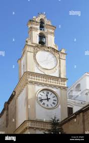 Gallipoli, Italy. The bell tower of the Cathedral Basilica of St. Agatha,  built in the early 1700, also with a clock and a sundial Stock Photo