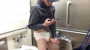 Handsome young stud caught maaturbating in public bathroom (18+) Gay Porn  Video - TheGay.com
