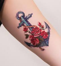 This tattoo deviates from traditional tribal styling by not coloring the designs black. 121 Most Amazing Anchor Tattoo Designs Besttattooguide Com