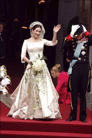 Mary wore a wedding dress created by danish fashion designer uffe frank with a veil first used by crown princess margareta of sweden, and then by her daughter queen ingrid of denmark. Crown Princess Mary Of Denmark S Best Outfits Fashion Princess Mary Of Denmark Style Evolution