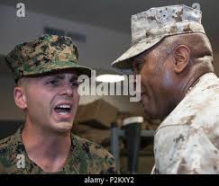 U.S. Marine Drill Instructor Gunnery Sgt. James Williams corrects a  candidate during Charlie Company's first Platoon Commander Inspection,  Officer Candidate School, Marine Corps Base Quantico, Va., Sept. 30, 2016.  Candidates are inspected