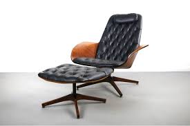 This walnut chair and ottoman were inspired by vintage 50's mid century modern designs. Mid Century Modern Lounge Chair