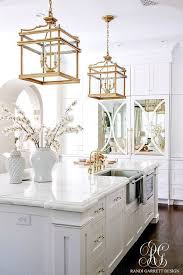 Stunning White Transitional Kitchen With Brass Chandeliers Faucets Pot Filler And Handles Two White Kitchen Remodeling Elegant Kitchens White Kitchen Design