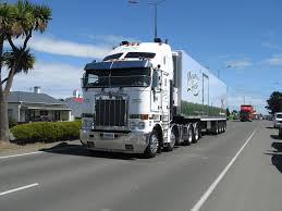 Bill This New Zealand Operated Cab Over Kenworth K200 Twin Steer Pulls A Four Axle Semi Trailer With Diary Products In The Meadow Fr Kenworth Trucks Cab Over