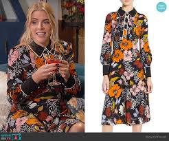 Layers of blue tie a busy oriental rug together with patterned pillows and a grid of artwork. Wornontv Busy S Floral Pearl Button Shirtdress On Busy Tonight Busy Philipps Clothes And Wardrobe From Tv