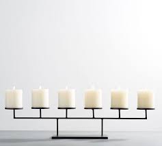 Maybe you would like to learn more about one of these? Black Metal Row Centerpiece Pillar Candleholders