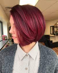 Cranberry Hair Color Is Trending Just In Time For The Holidays The Maroon Hue Resembles The Dark Red Almost Mage Cranberry Hair Color Maroon Hair Hair Styles