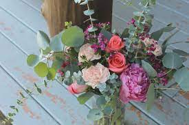 Fresh Floral Arrangement Using Eucalyptus Silver Dollar Eucalyptus Peachy Pink Carnations Coral Movie Star Roses Magent Pink Carnations Pink Peonies Floral
