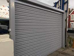 Happy Client With Our Rsg5000 Solid Steel Security Shutter With Goal Post Fitted To His Car Wash Company In Harrow Roller Shutters Security Shutters Shutters