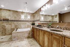 It comes in so many different colors so you've just put in beautiful granite tile in your shower, and you want to show it off. Luxury Bathroom Interior With Tile Floor Bath Tub With Brown Stock Photo Picture And Royalty Free Image Image 59951766