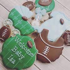 Erin Brankowitz On Instagram Football Themed Baby Shower Cookies I Love The Rattle Football Baby Shower Sports Baby Shower Football Baby Shower Theme