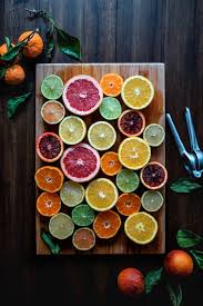 Assorted Sliced Citrus Fruits On Brown Wooden Chopping Board Bienfait Des Fruits Fruit Fruits