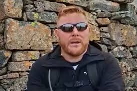 Blind war veteran who lost sight in explosion that killed two pals climbs  Ben Nevis in their memory