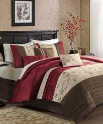 A canopy is lightly draped over the head of this twin bed, with white footstools at the end of the bed and white bedside tables. 35 Burgundy Bedding Ideas Comforter Sets Bedding Sets Bedroom Decor