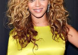 Voluminous half updo curly hairstyle for long hair. The Best Haircuts For Curly Haired Girls